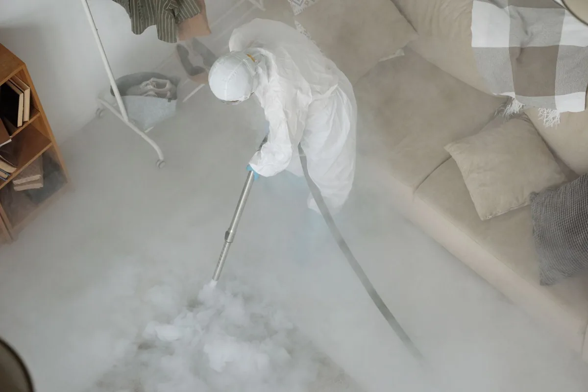 Biohazard cleanup technician in protective equipment, Schertz, TX